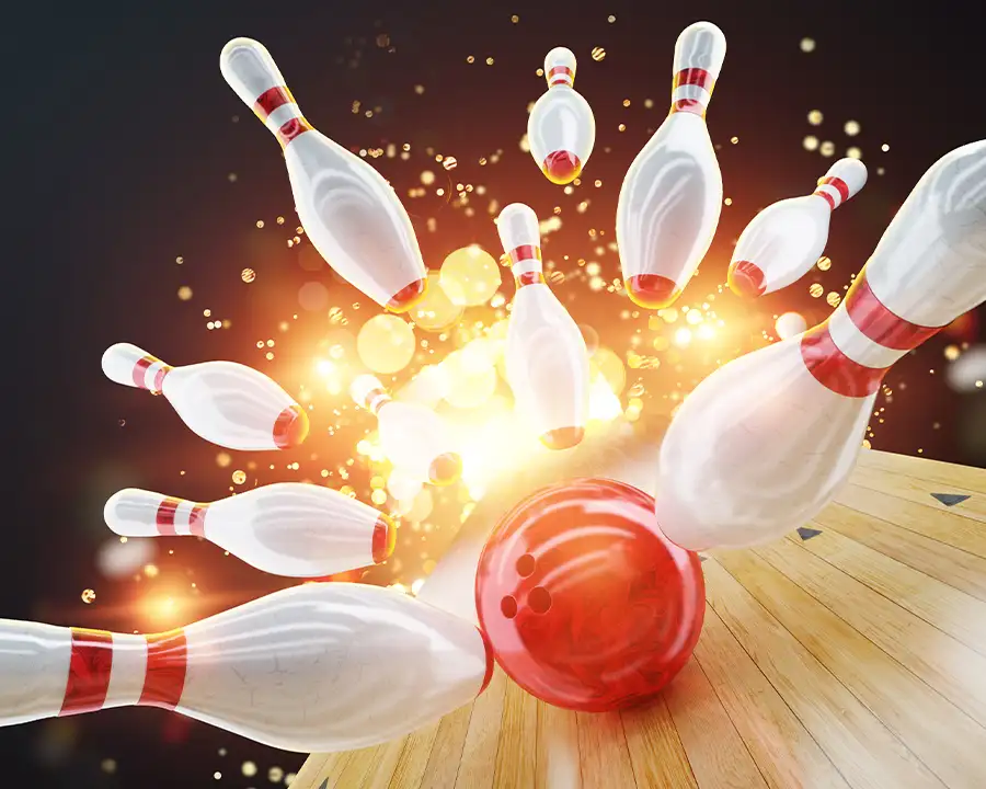 Bowling ball striking pins in a dramatic strike at Pro Bowl West in Fort Wayne, IN