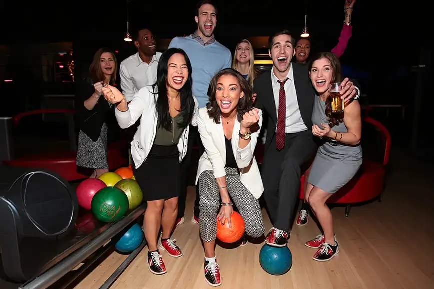 Coworkers celebrating a strike during a work outing/team building event at Pro Bowl West in Fort Wayne, IN