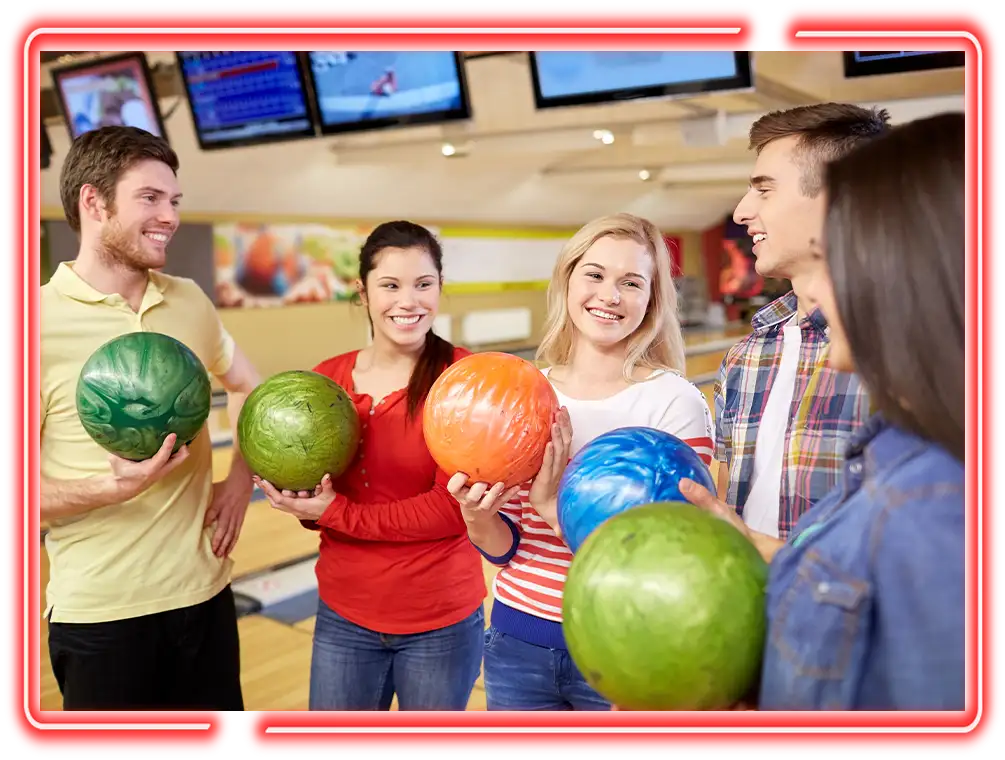 Friends picking out bowling balls before a game at Pro Bowl West in Fort Wayne, IN