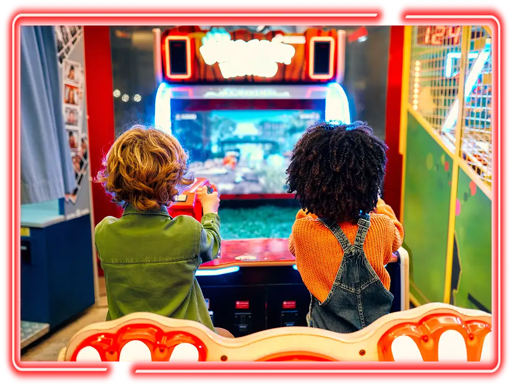 Kids playing arcade games in the game room at Pro Bowl West in Fort Wayne, IN